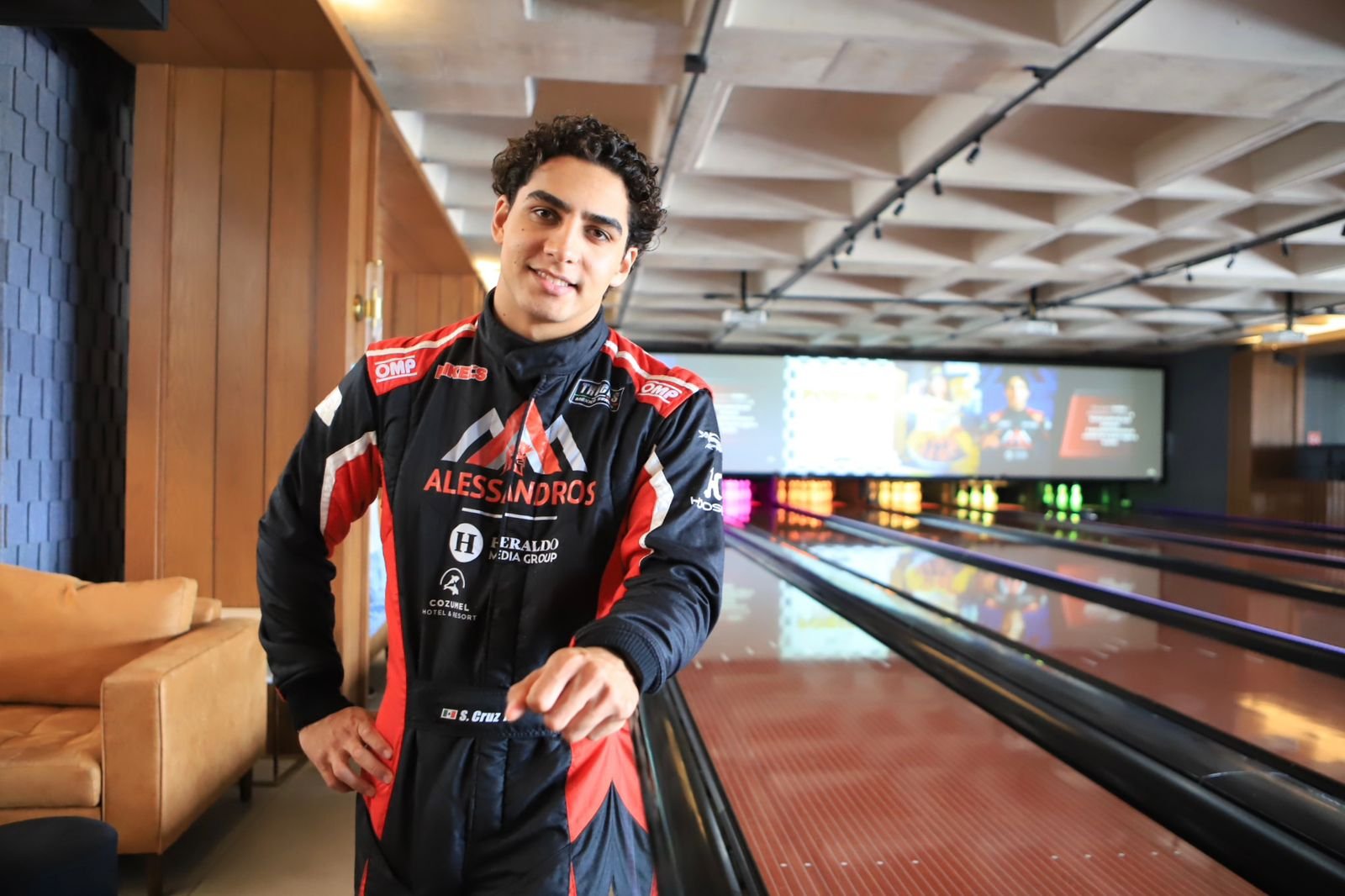 Driver Santiago Cruz in racing gear at the Tulum NASCAR event