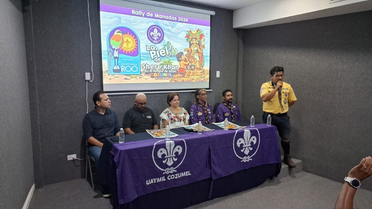 Group of scouts in uniform camping at Chankanaab park in Cozumel