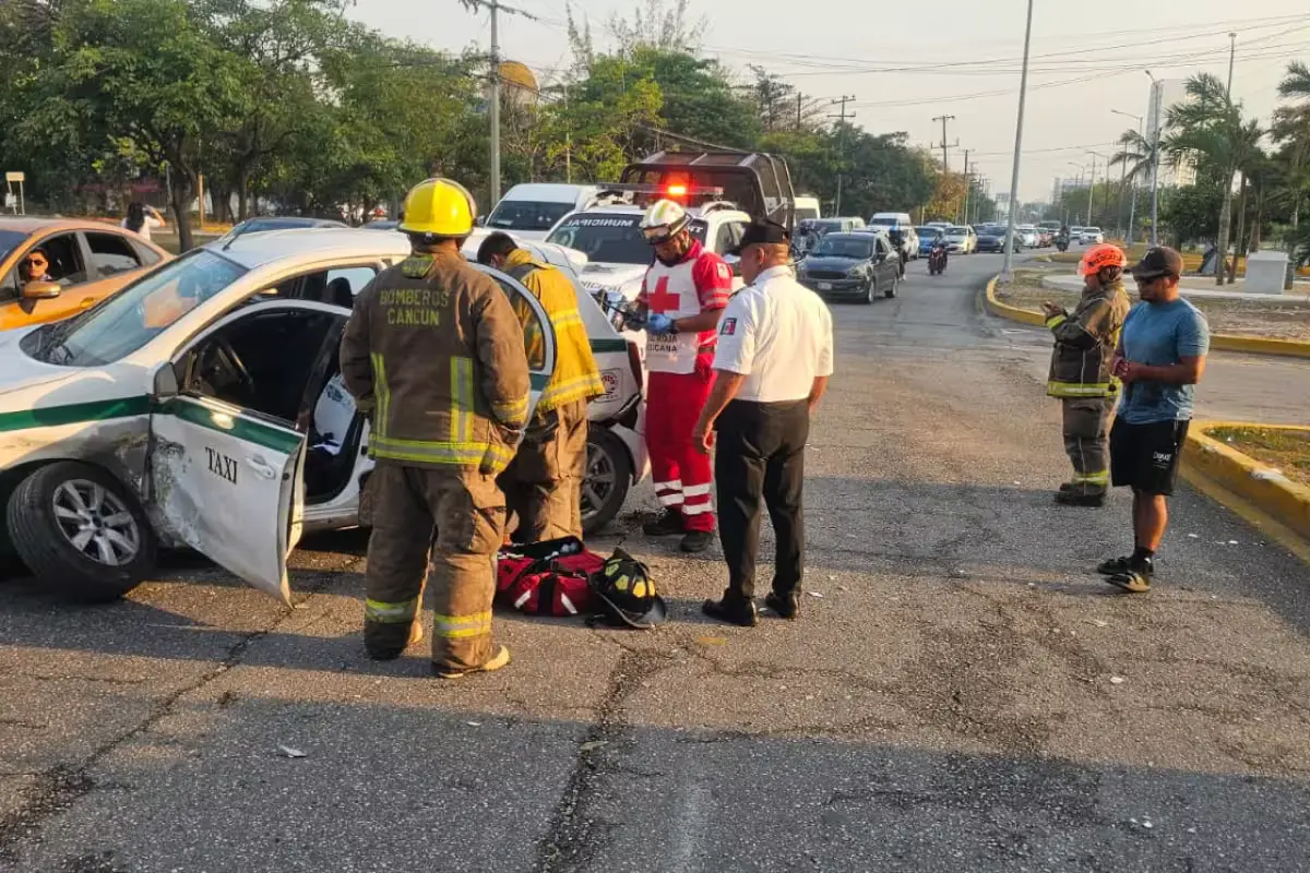 Emergency responders assist at the scene of a taxi collision on Bonampak Avenue in Cancun