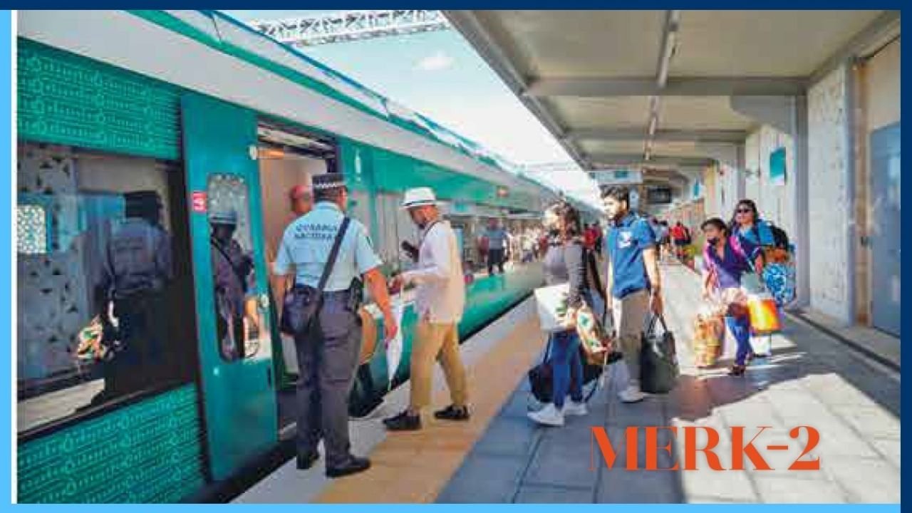 Passengers with luggage and sunglasses waiting at a Tren Maya station platform