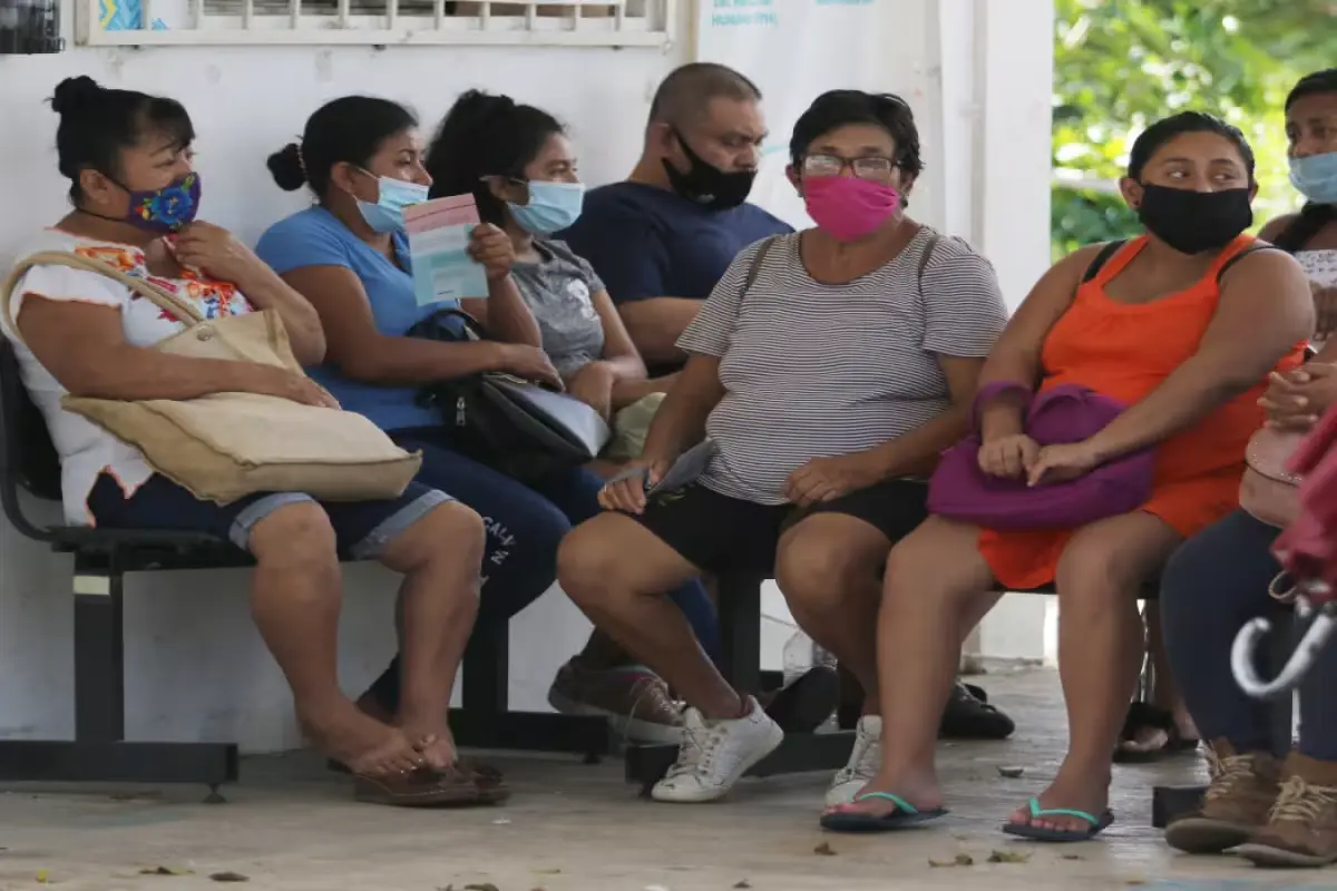 A medical professional reviewing health data, representing tuberculosis surveillance in Yucatán
