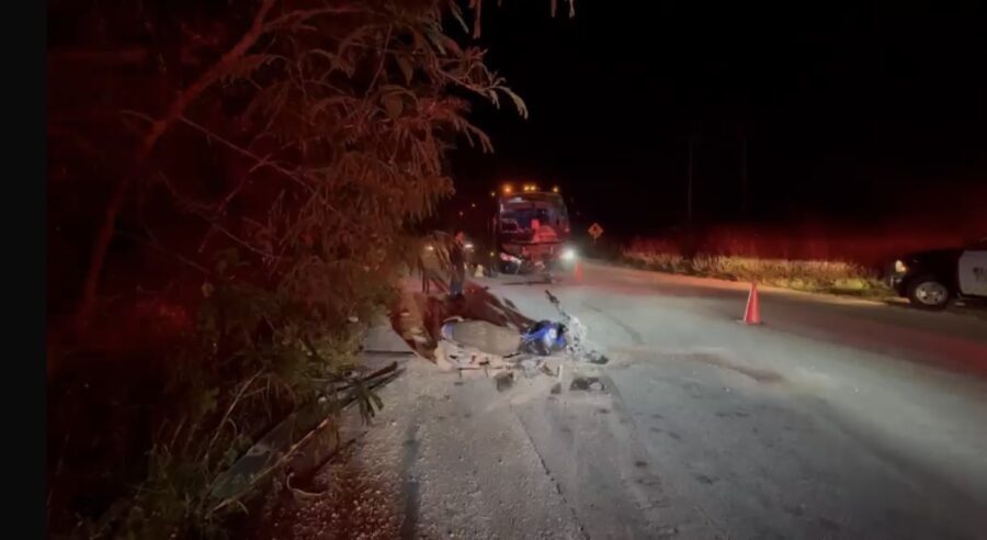 Emergency responders at the scene of a motorcycle-bus collision on the Tulum-Cobá highway