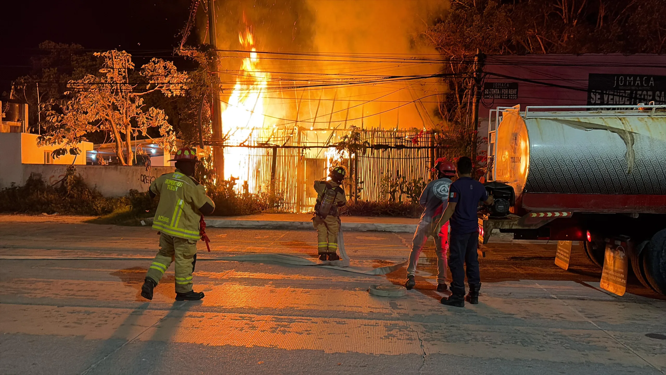 Firefighters and emergency personnel at the scene of one of three early morning fires in Tulum, Quintana Roo.