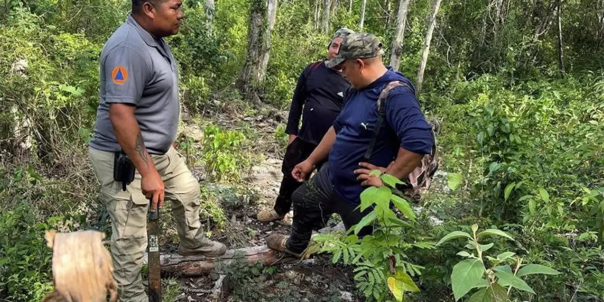 Emergency personnel assisting two rescued men in the Tulum jungle