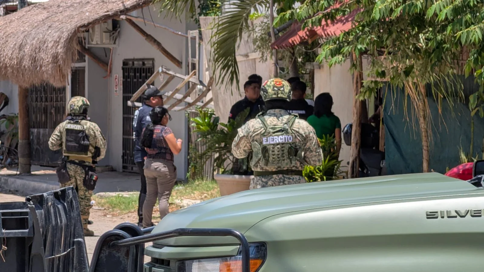 Police and military personnel conducting a raid operation in Tulum's Maya Pax neighborhood