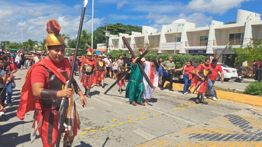Participants in the Via Crucis procession walk through the streets of Tulum, Quintana Roo, during Good Friday observances.