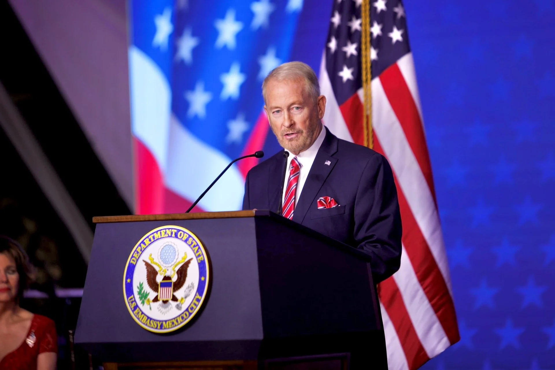US Ambassador to Mexico Ronald Johnson speaking at a podium during a ceremony in Los Mochis, Sinaloa