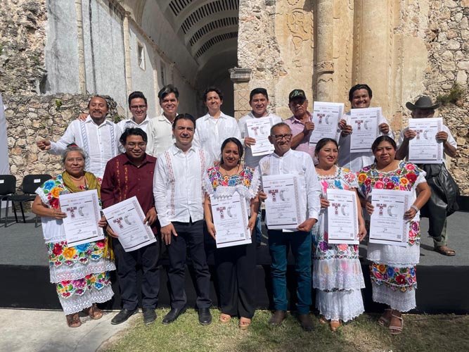 Officials and community members at a ceremony in Tihosuco, Yucatán, presenting community tourism certifications