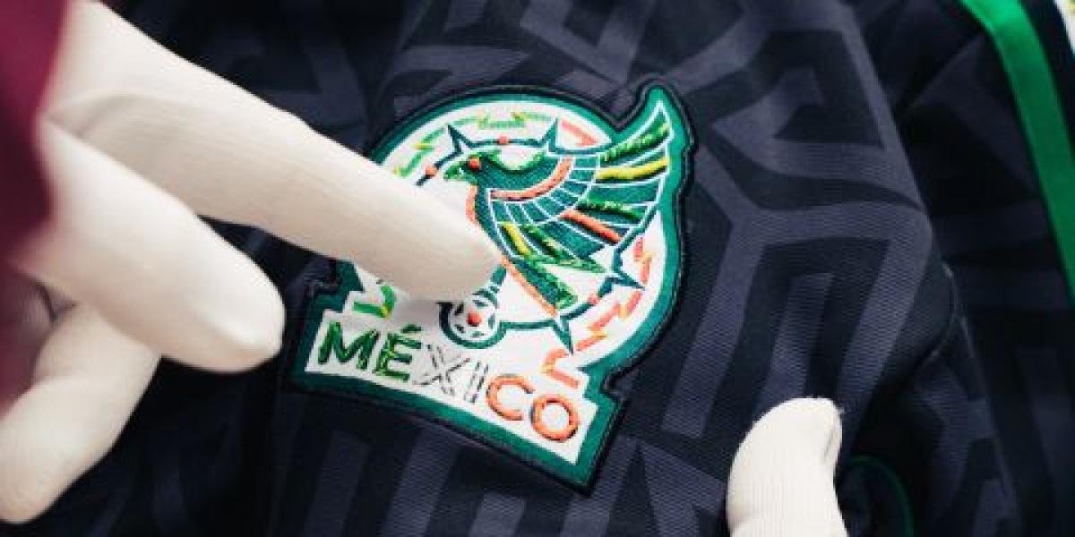 A hand-embroidered lifestyle jersey from the Adidas and Someone Somewhere collection, featuring floral details and the Mexican Football Federation crest.