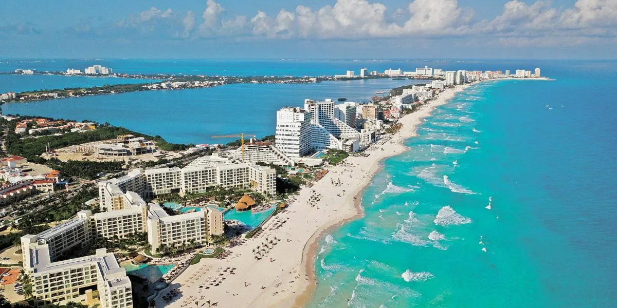 Aerial view of Riviera Maya coastline showing hotels and turquoise Caribbean water