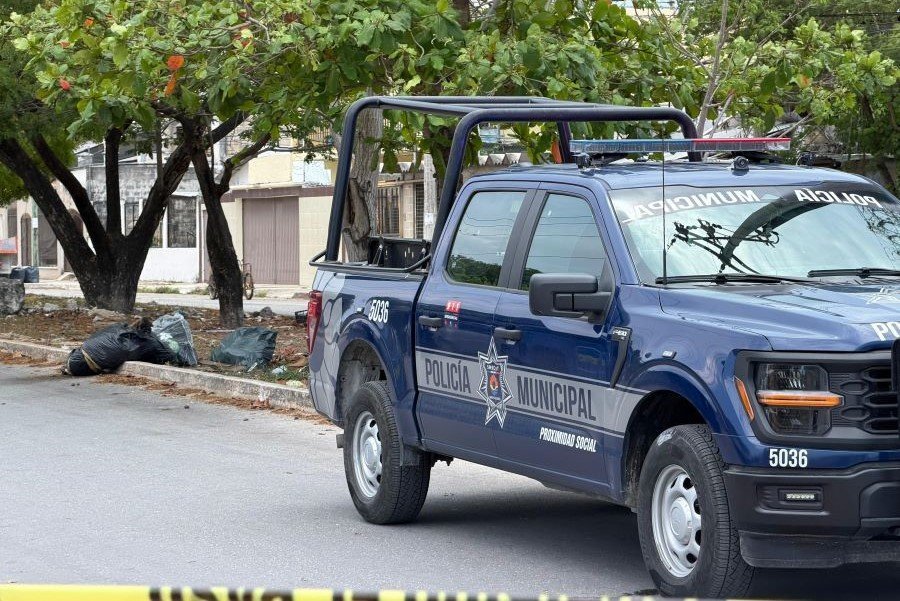 Police tape cordoning off area where a body was found in a bag on Centenario Avenue in Cancun