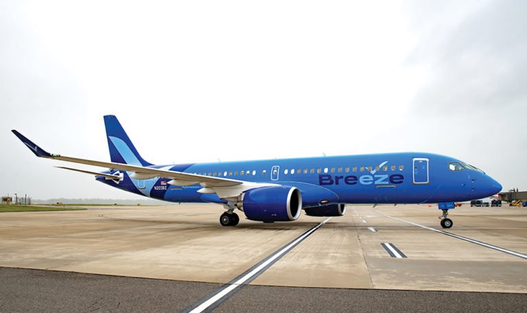 Breeze Airways airplane parked at Cancun International Airport