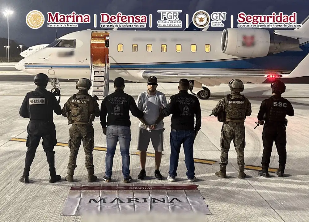 Canadian citizen Denis N being escorted by Mexican authorities in Cancun