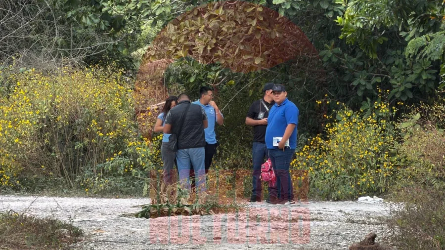 Police tape cordoning off a dirt road area in Cancun where a body was found