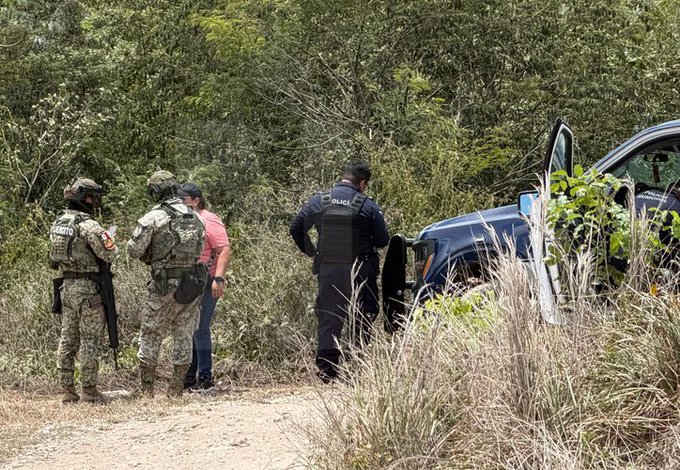Police tape cordoning off a dirt road in Cancun where human remains were found