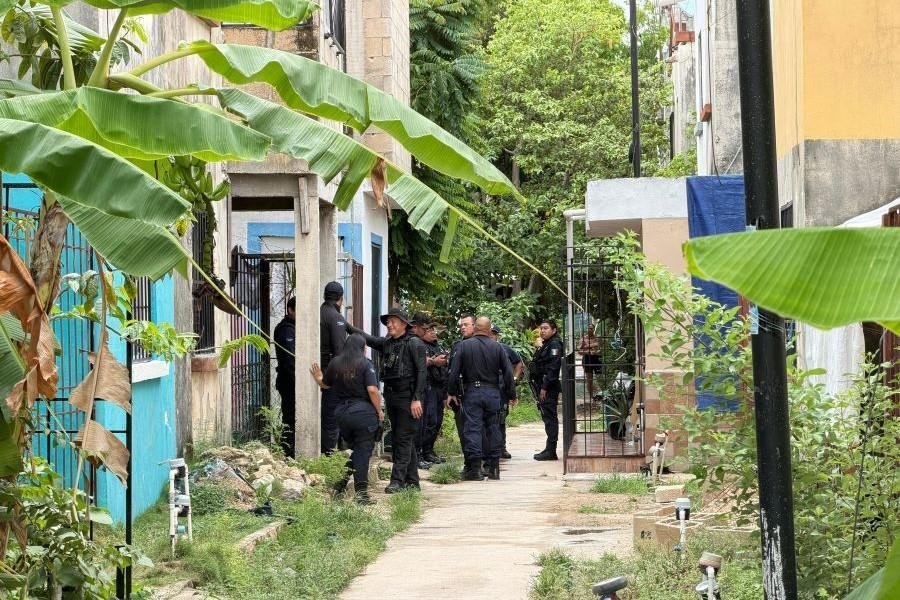 Police at the scene of a murder in Villas Otoch Paraiso, Cancun