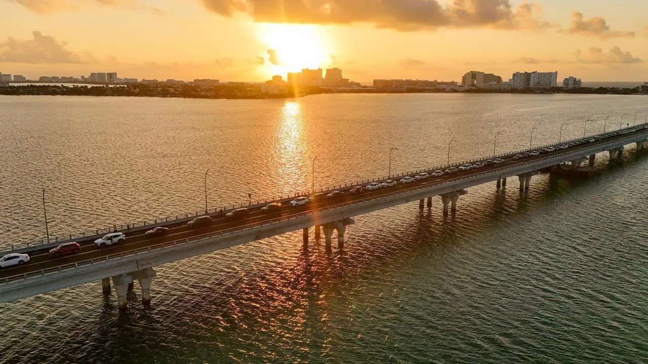 A public bus drives across the Nichupté Bridge in Cancun, Mexico