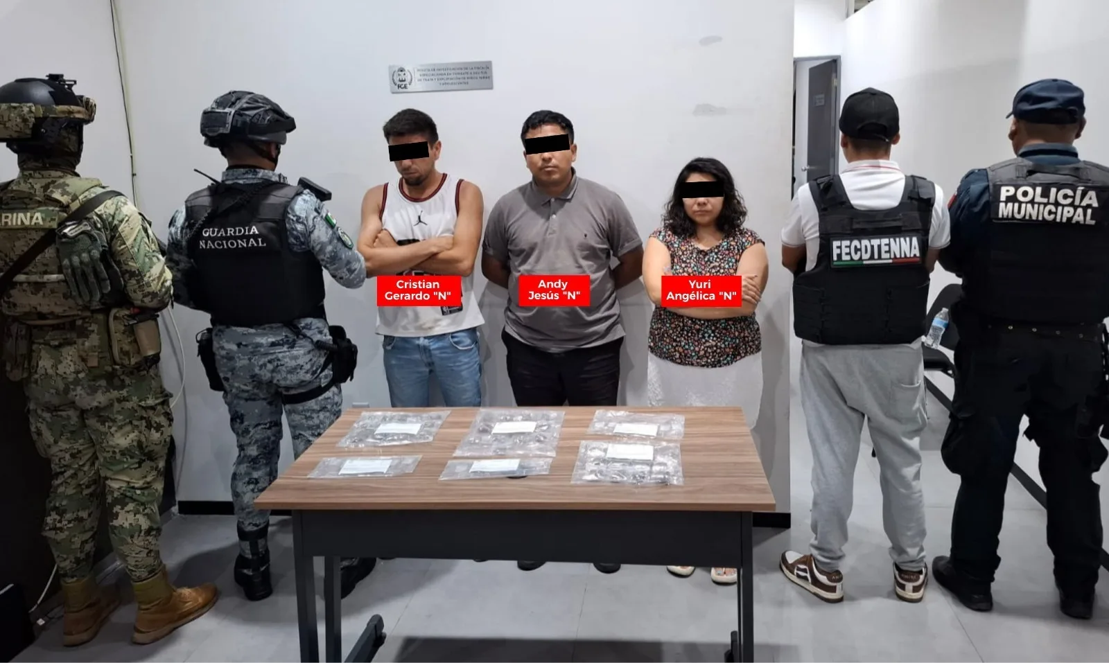 Police officers at the scene of a raid in Cancun's Real Tikal neighborhood