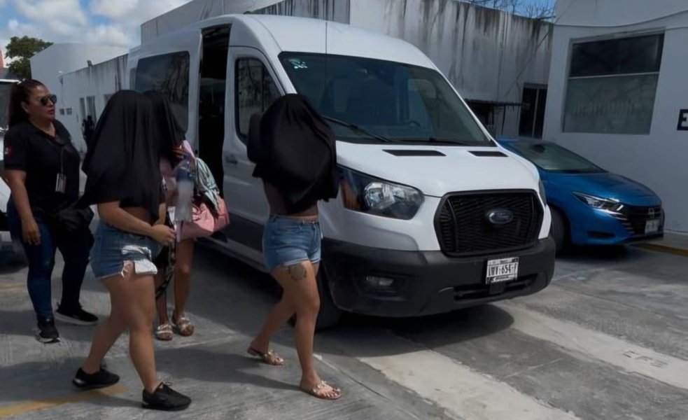 Police officers at a property in Cancun during a trafficking rescue operation