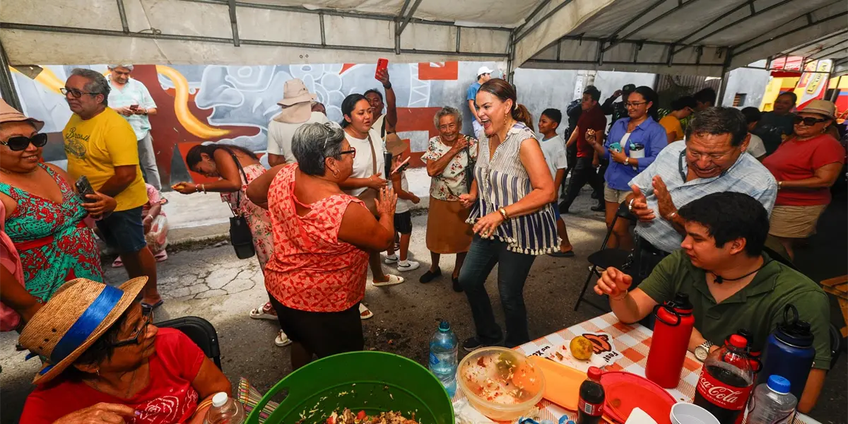 People enjoying chicharra at the festival in Xcalachen, Merida