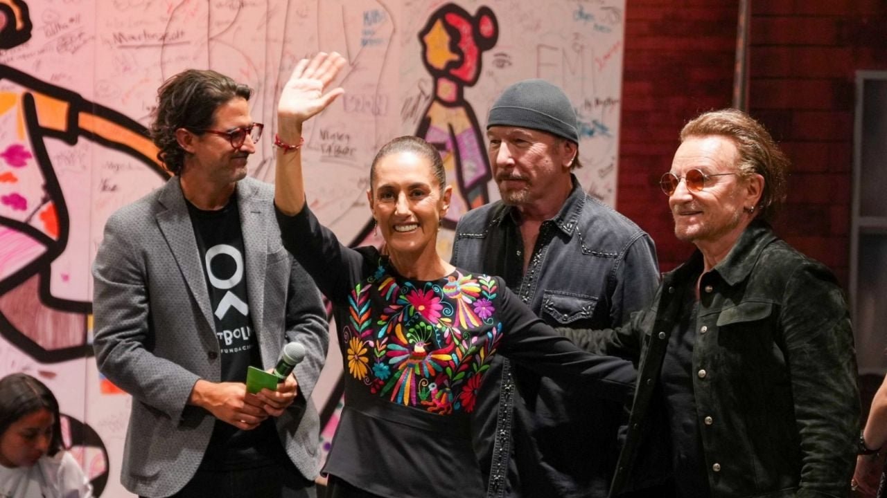 Mexican President Claudia Sheinbaum stands with U2 members Bono and The Edge at the Street Child World Cup event.