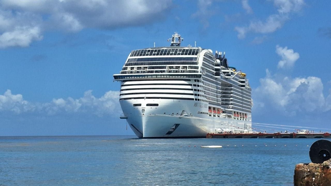 Cruise ship docked at Cozumel port with turquoise water