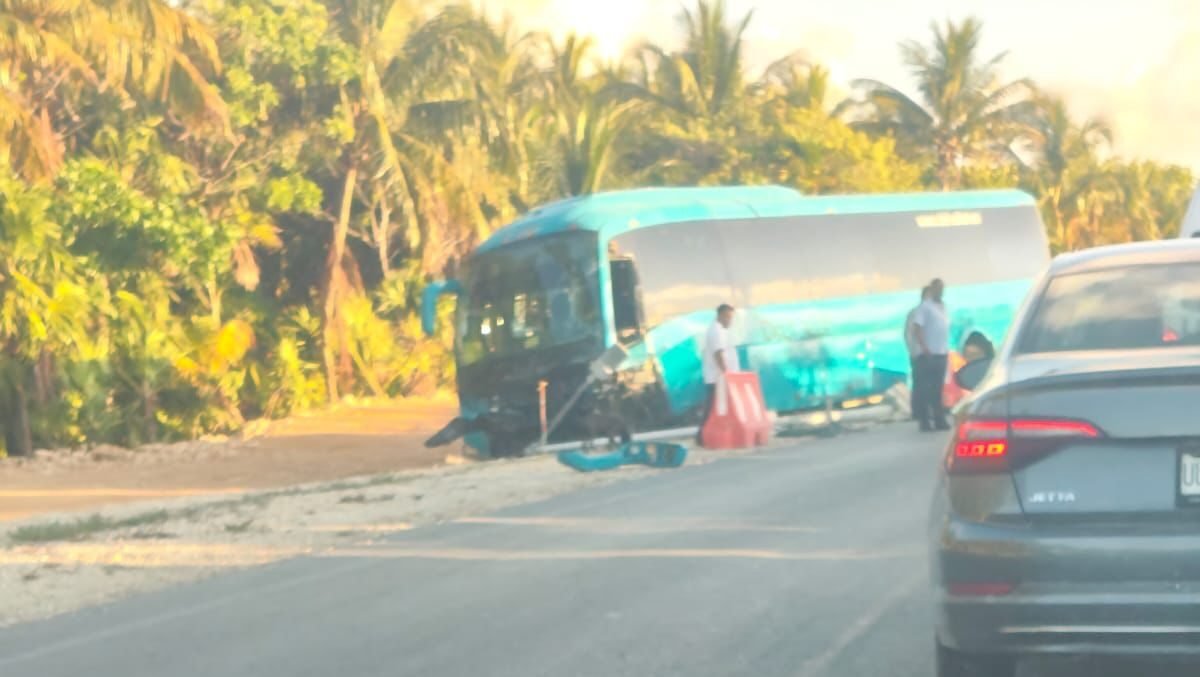 Emergency responders at the scene of a fatal crash between a bus and an SUV on the Punta Sam-Isla Blanca highway