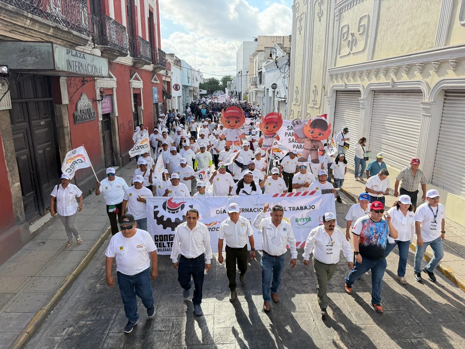 Thousands of workers from the CROC union march through the streets of Merida, Yucatan, on May Day 2026, carrying banners demanding higher wages and tax relief.