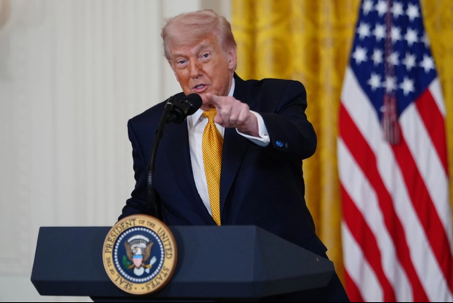 US President Donald Trump speaking at a podium in the White House during Mother's Day commemorations