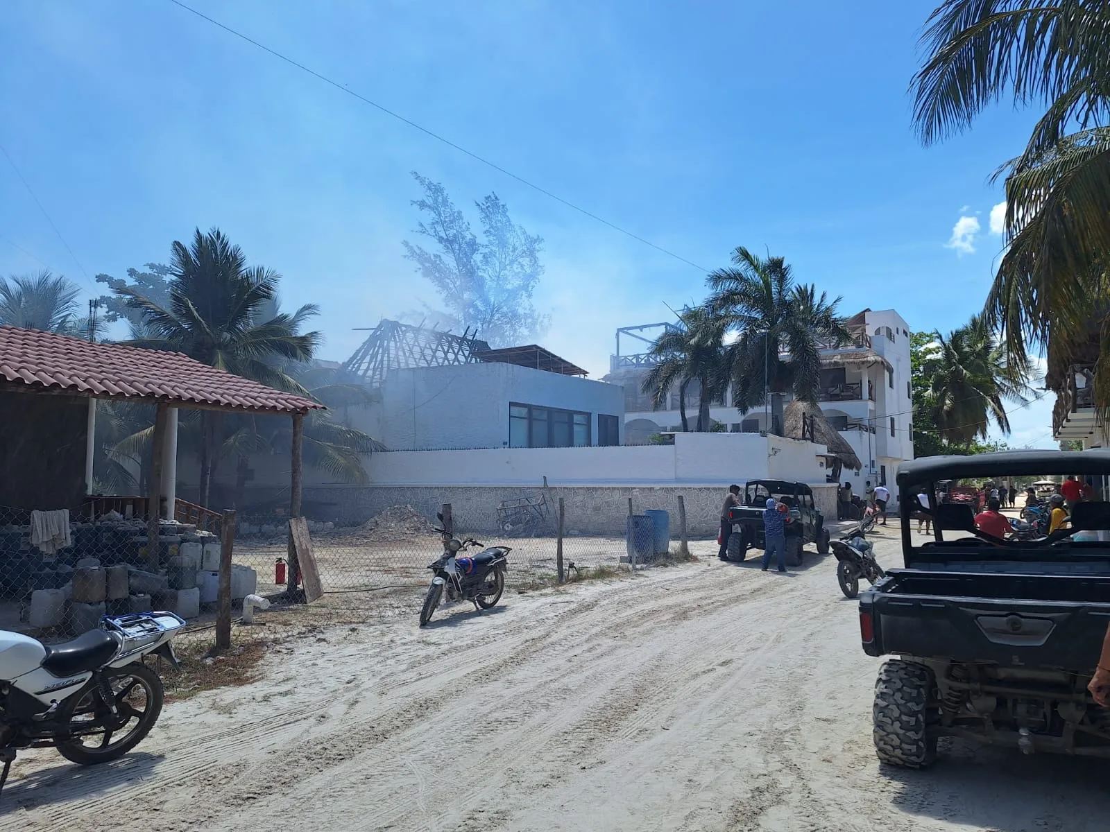 Firefighters and volunteers work to extinguish a fire at the Villas Ponto hotel on Holbox Island, Quintana Roo.
