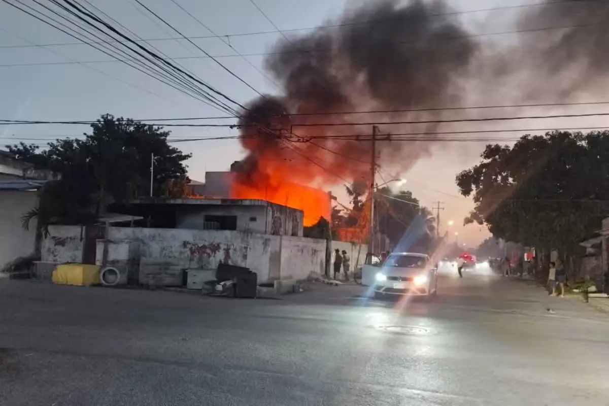 Firefighters working to extinguish a fire that destroyed a home in Cancun's Supermanzana 220