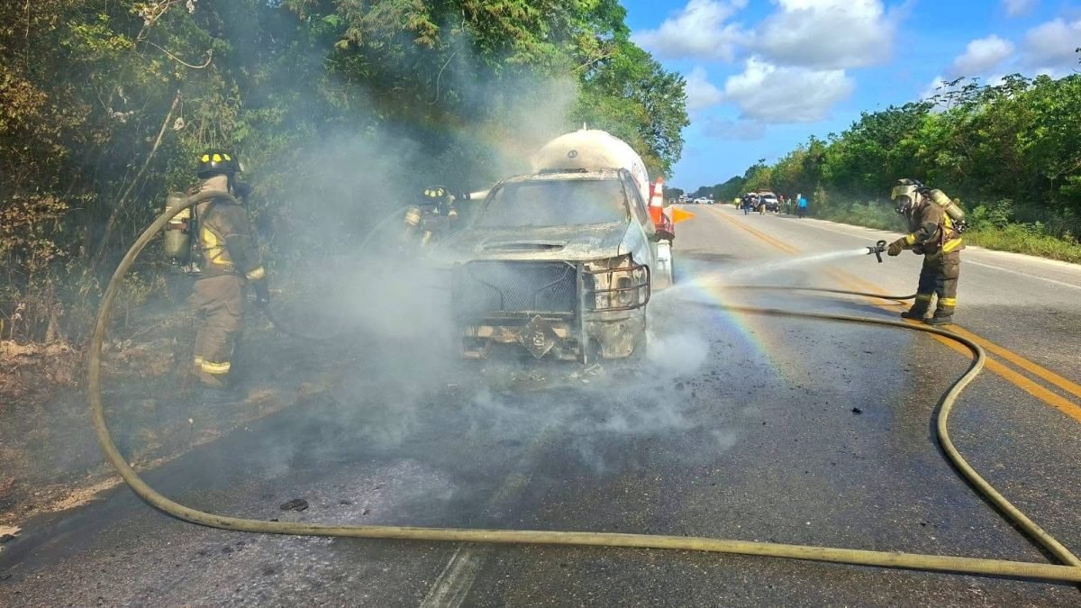 Firefighters battling a blaze on a gas tanker truck on a highway near Cancun, Quintana Roo