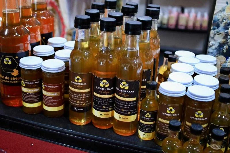 Display of Yucatecan honey and derived products at Semana Yucatán fair in Mexico City
