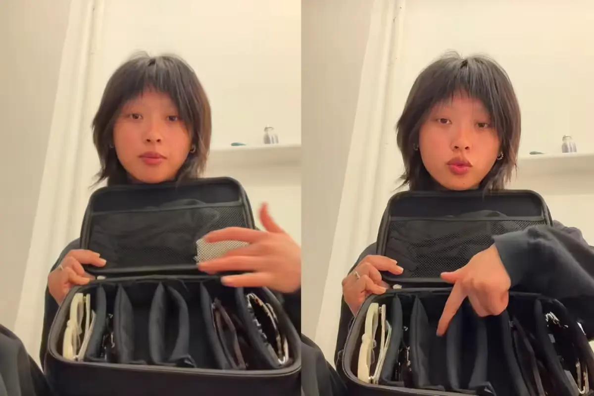 Influencer Sabrina Lan holds up her luggage while describing theft at Cancun airport