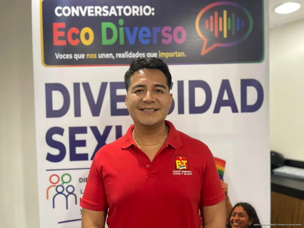 Members of the LGBTQ+ community holding rainbow flags at a rally in Chetumal, Quintana Roo