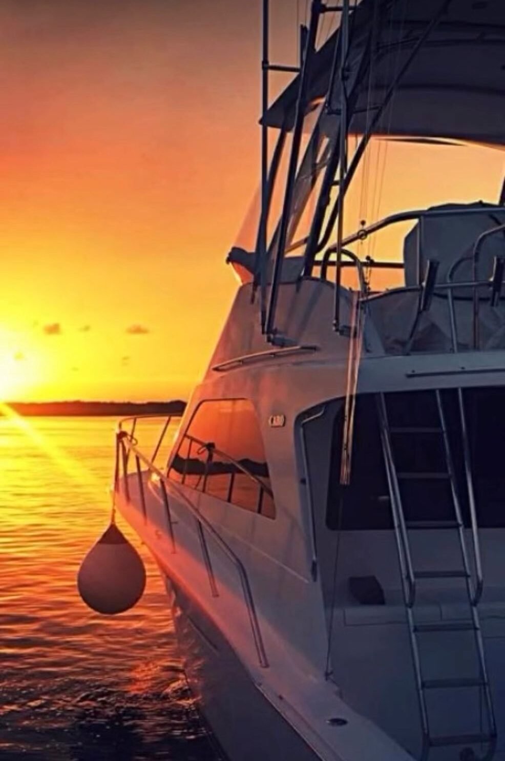 A luxury yacht sailing in the turquoise waters near Isla Mujeres, Quintana Roo, Mexico