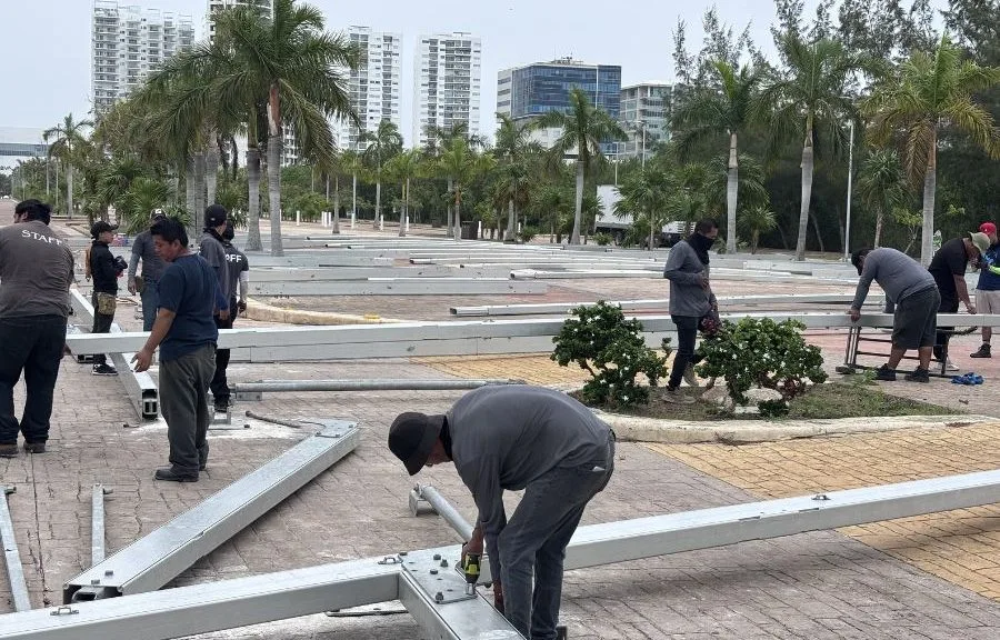 Workers install a large tent at Malecón Tajamar in Cancun for the broadcast of President Claudia Sheinbaum's message