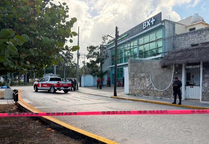 Emergency responders at a motorcycle accident scene in Cancun
