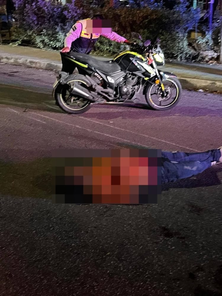 Police and paramedics at the scene of a motorcycle accident near Palmas 1 in Playa del Carmen