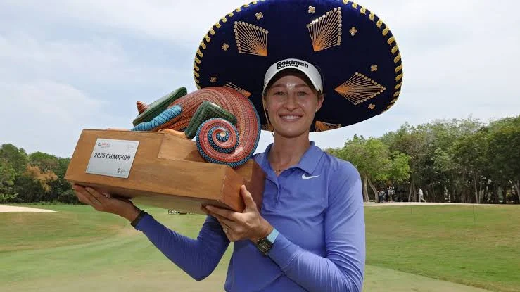 Nelly Korda holding the winner's trophy at the Riviera Maya Open at Mayakoba 2026