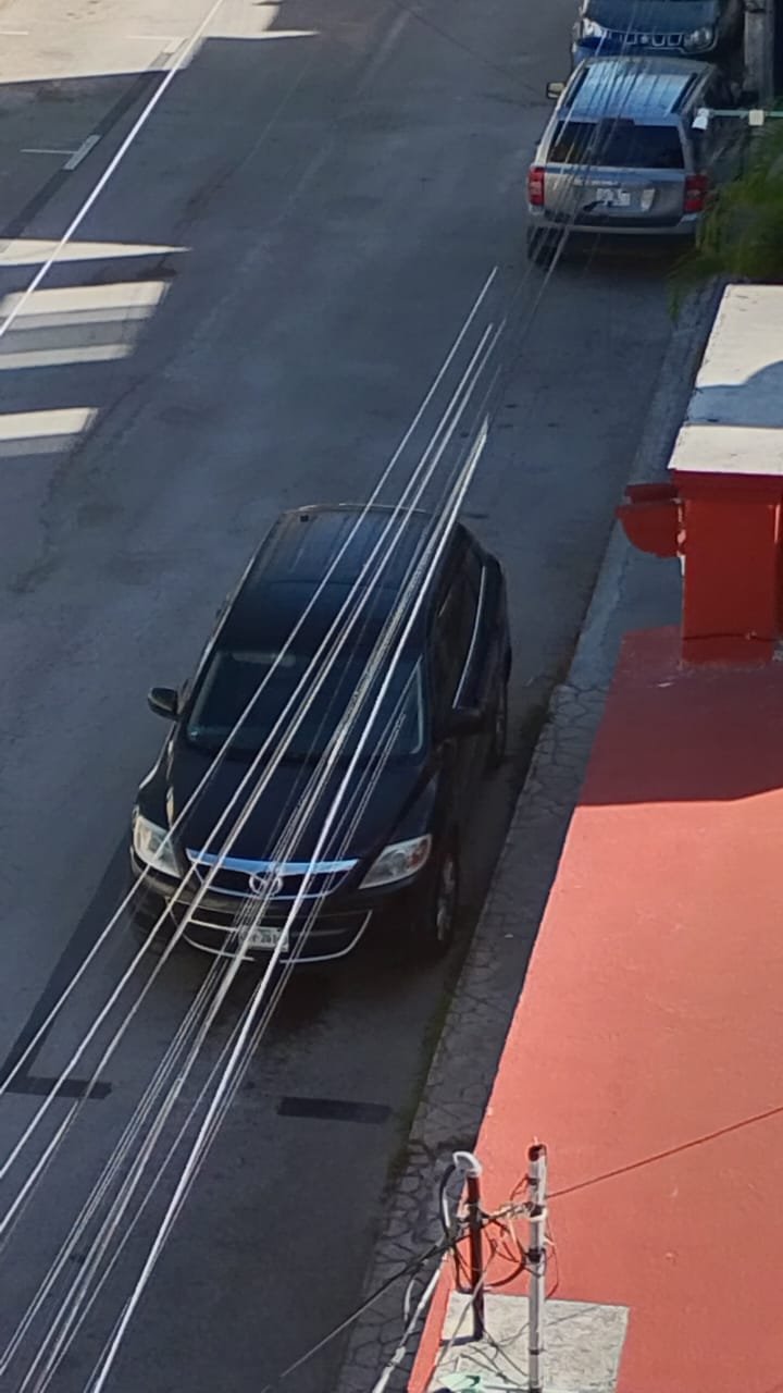 A parking meter space on a residential street in Playa del Carmen, painted over with black paint after a councilwoman complained.