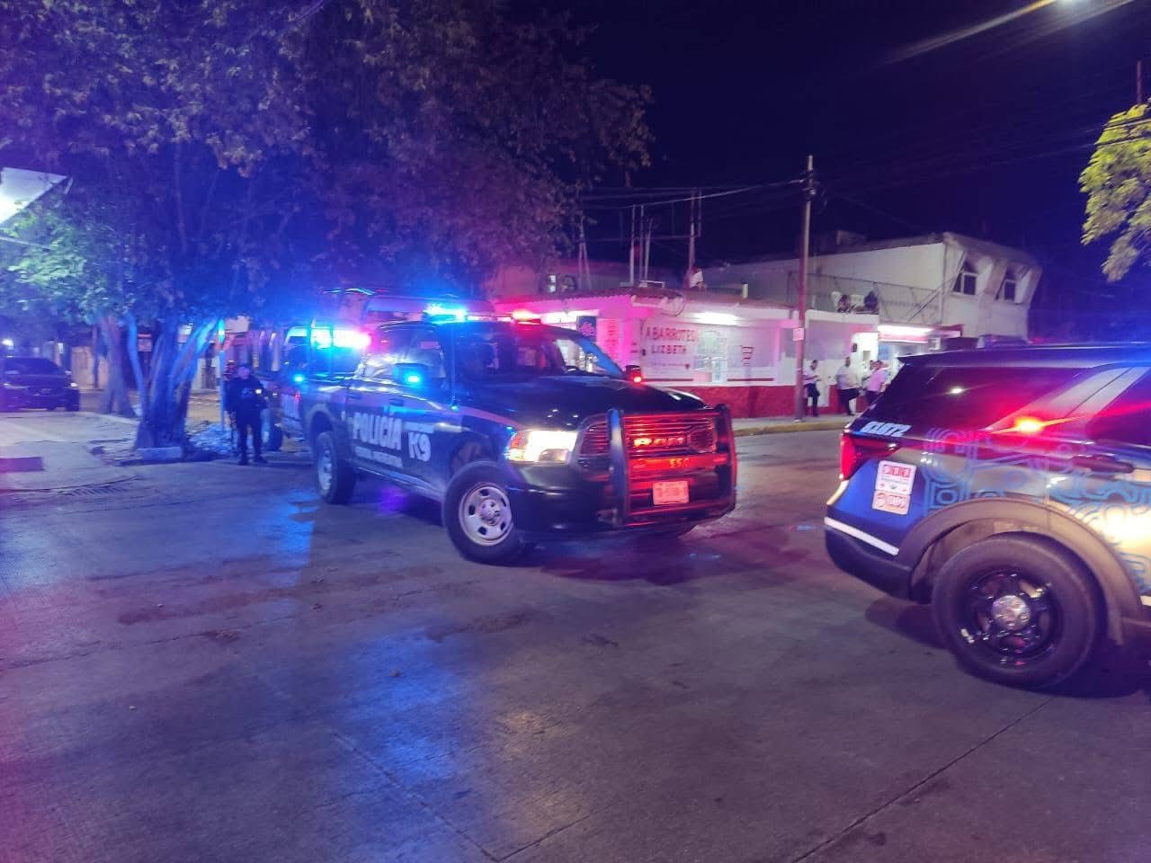 Police officers cordon off the area after a shooting at Bar El Antídoto in Playa del Carmen, Quintana Roo.