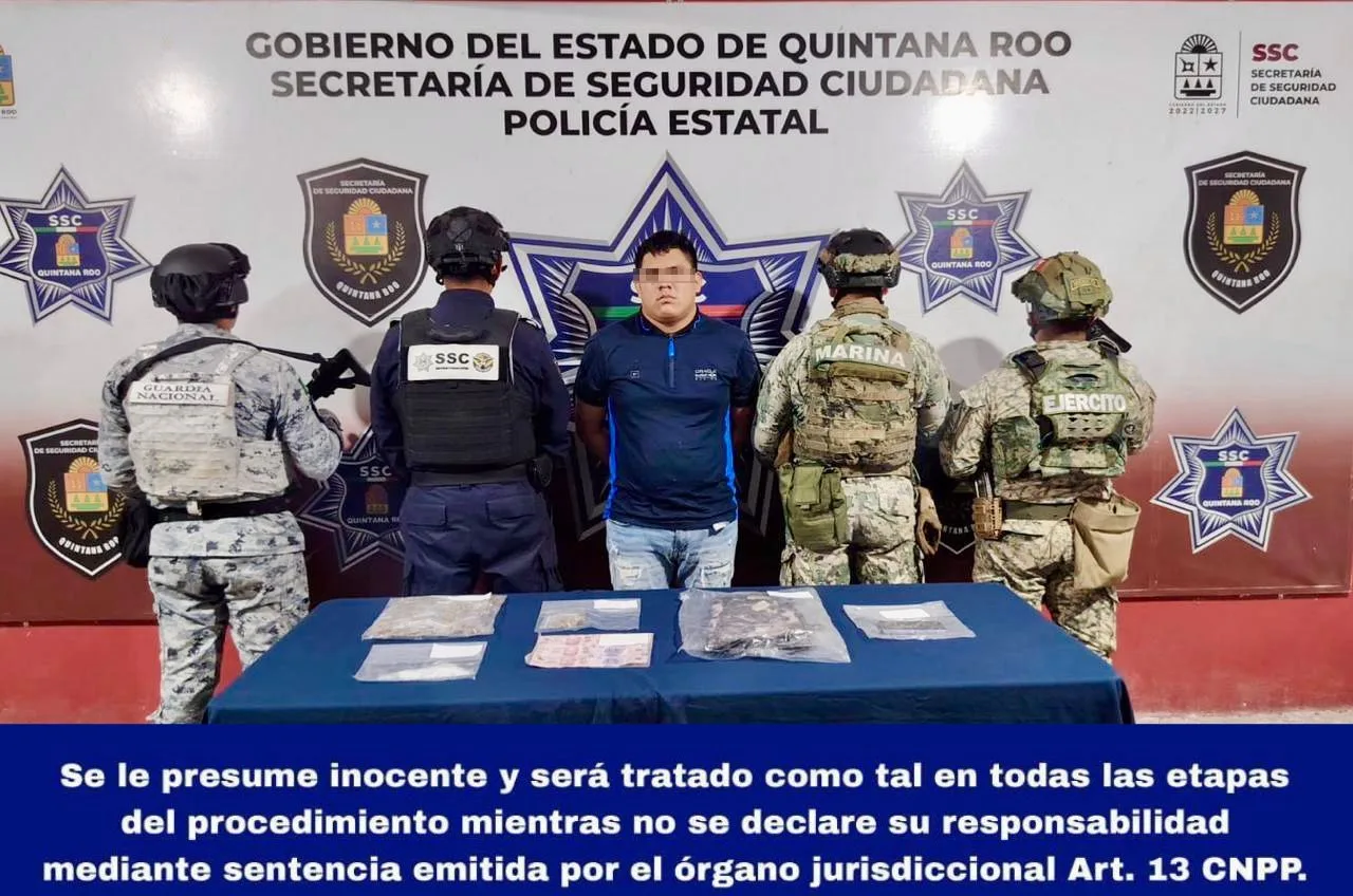 Police officers at a joint operation in Cancun, Quintana Roo, arresting a suspected drug distributor.