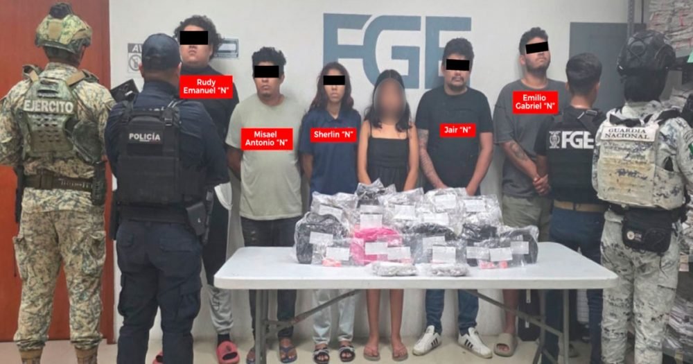 Police officers conducting a raid in Playa del Carmen