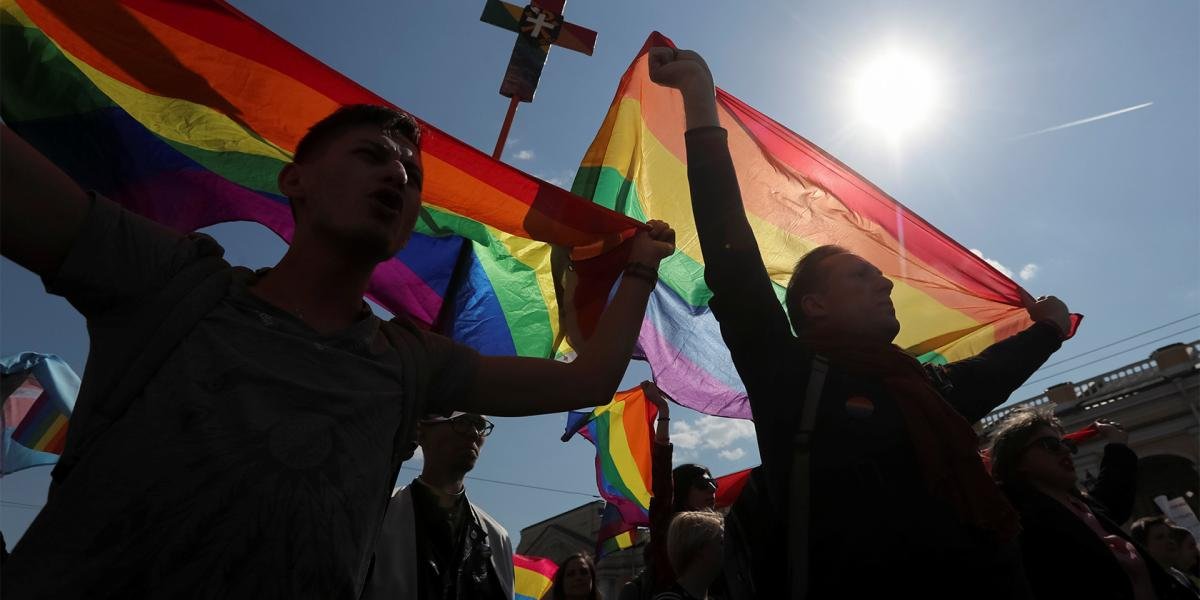 A rainbow flag flying at an International Day Against Homophobia event