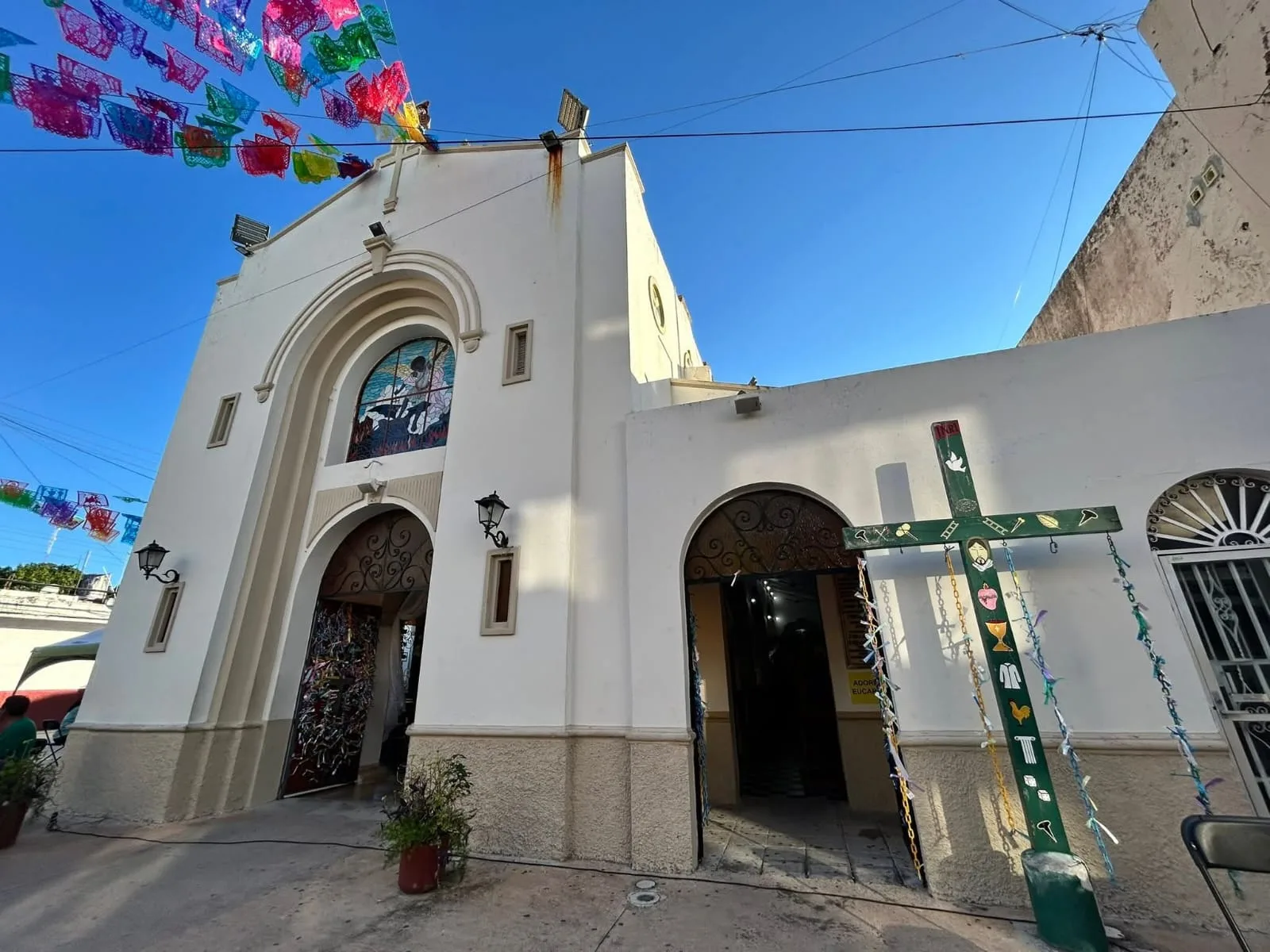 Exterior view of San Miguel Arcángel Church in Cozumel, decorated for its 80th anniversary celebrations