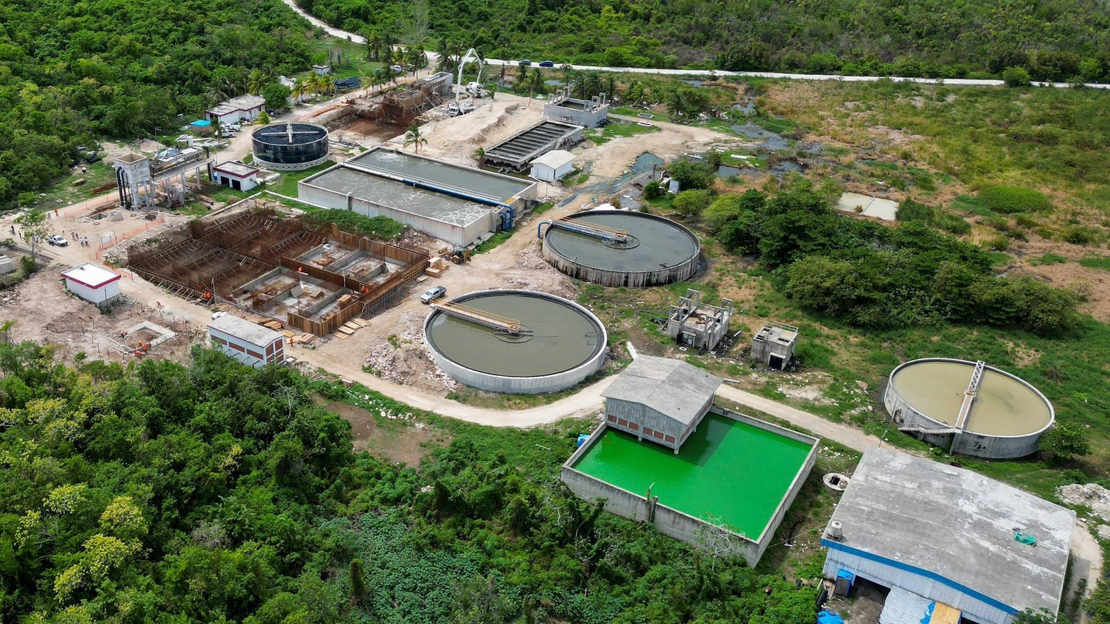 Aerial view of the San Miguelito wastewater treatment plant in Cozumel, surrounded by mangroves