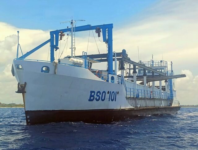 A large ship designed for sargassum collection at sea off the coast of Quintana Roo, Mexico.