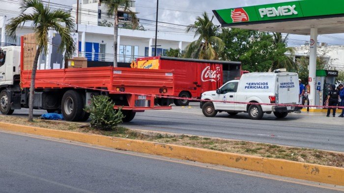 Police tape cordons off the area where a pedestrian was killed by a truck in Playa del Carmen