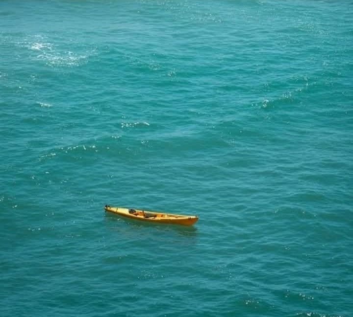 Boats and rescue personnel search the waters off Holbox Island for a missing tourist